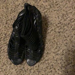 Black BCBGeneration size 10 . Has be worn stain at the bottom of shoe .